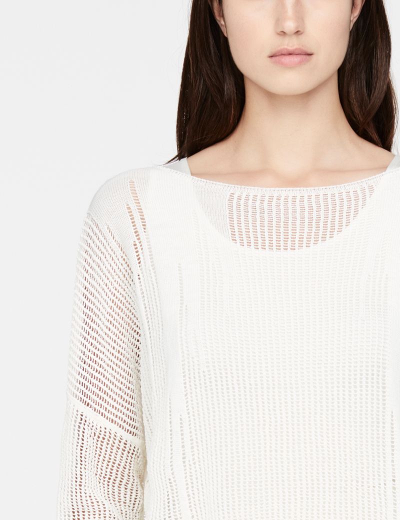 Sarah Pacini trui met gaatjes - boothals