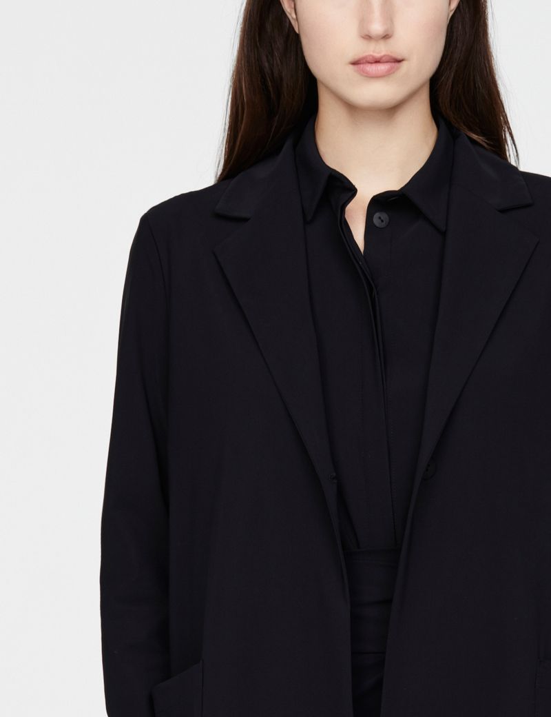 Sarah Pacini lange jas - ingesneden revers