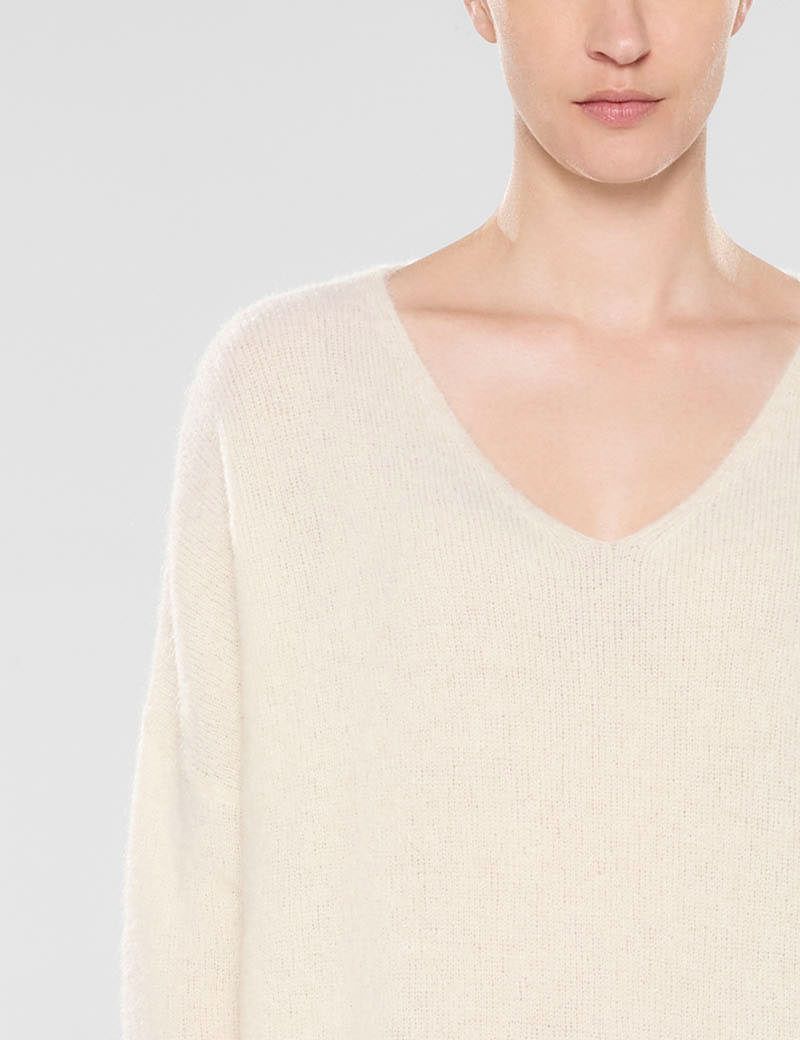 White v-neck long sweater by Sarah Pacini