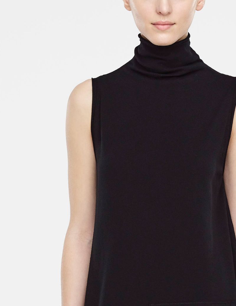 Black sleeveless dress with asymmetrical hem by Sarah Pacini