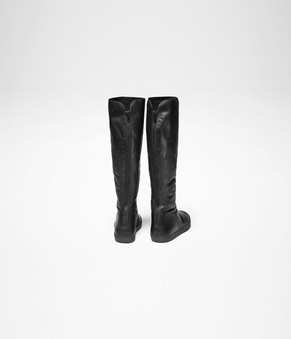 Black leather tall leather boots by Sarah Pacini