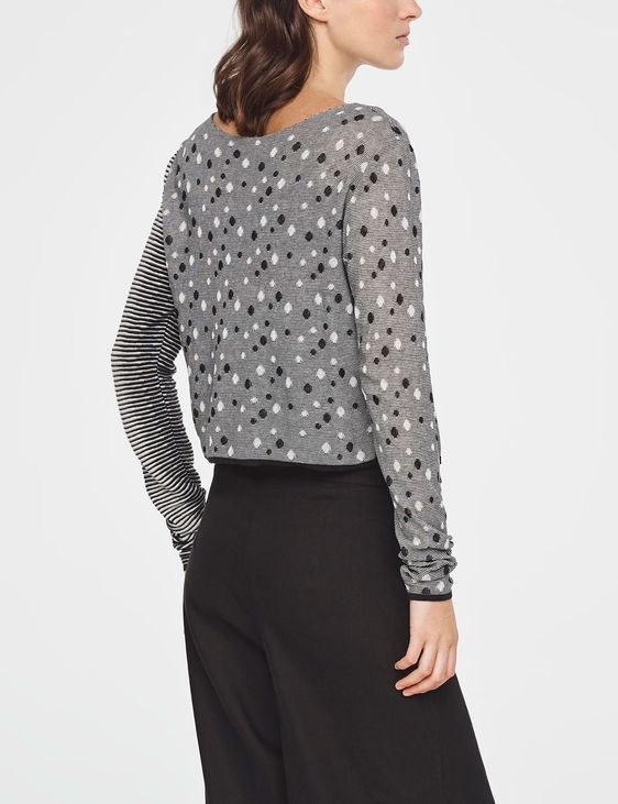 grey sweater with white polka dots