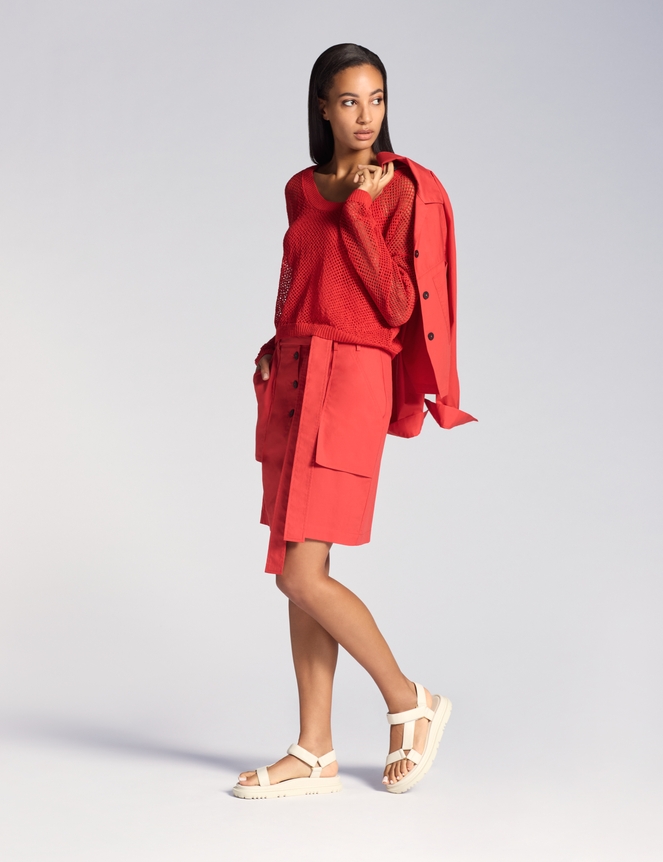 Poppy red knielange rok – stadsavontuur Sarah Pacini