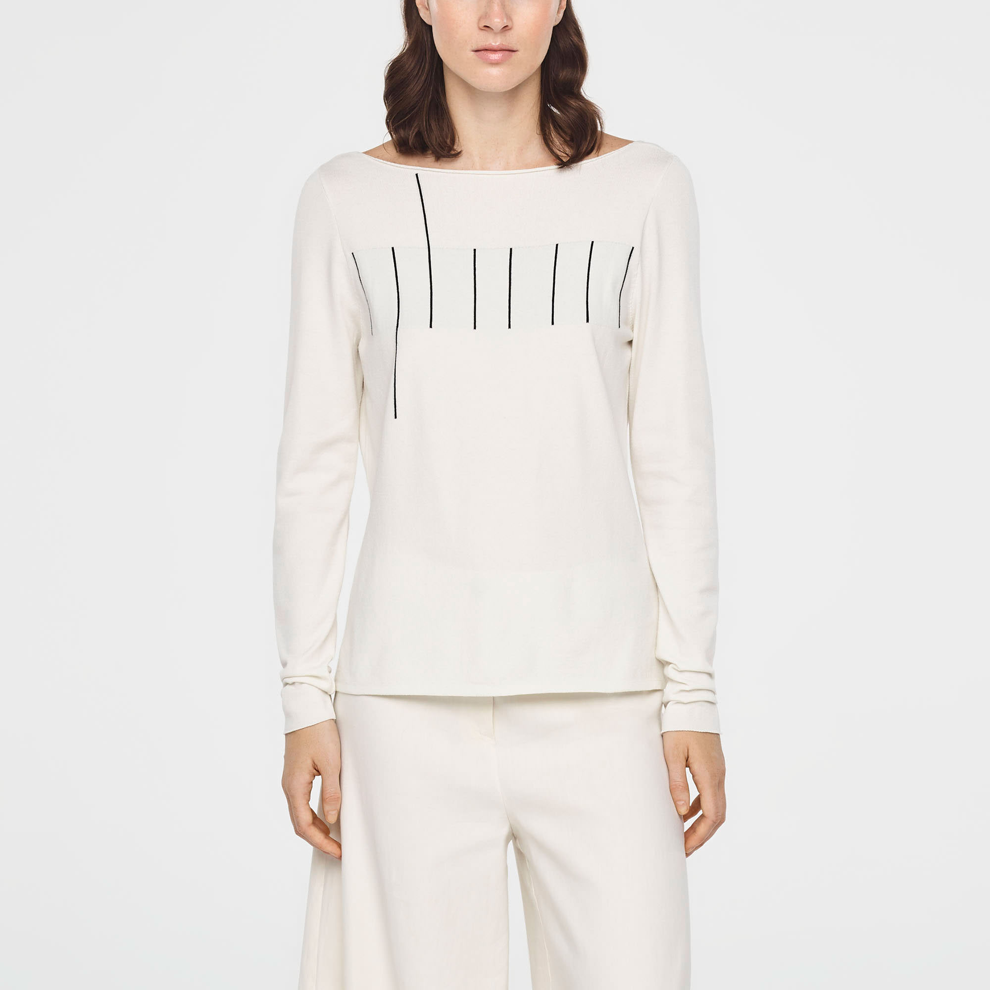 low-cut back sweater by Sarah Pacini