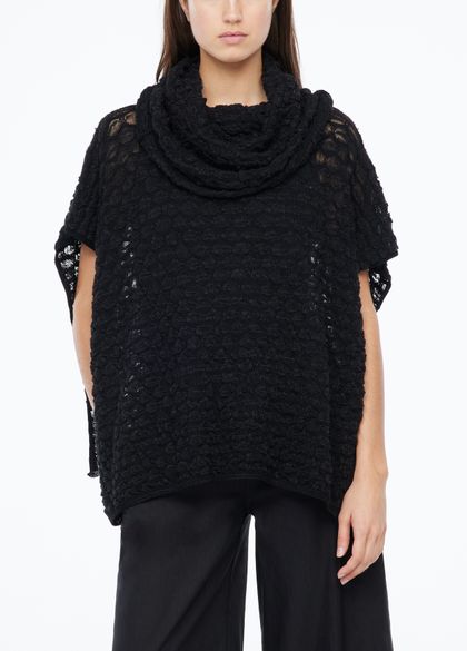 Buy your women's ponchos online at Sarah Pacini